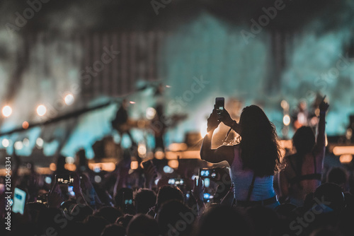 Woman taking shot of stage photo