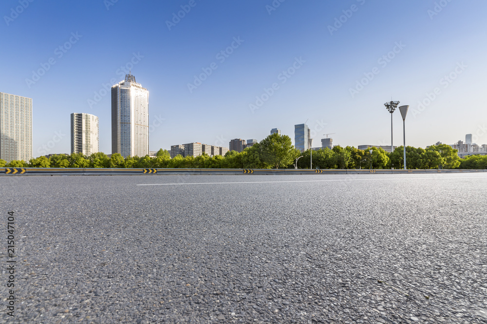 Panoramic skyline and modern business office buildings with empty road,empty concrete square floor