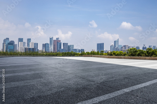 Panoramic skyline and modern business office buildings with empty road,empty concrete square floor