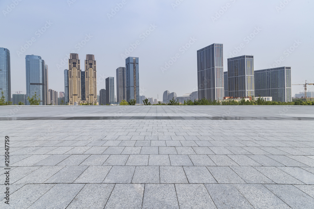 Panoramic skyline and modern business office buildings with empty road,empty concrete square floor