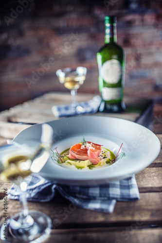Marinated salmon with cream cucumber and dill.