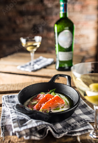 Marinated salmon with cream cucumber and dill.