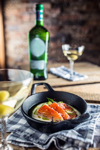 Marinated salmon with cream cucumber and dill.