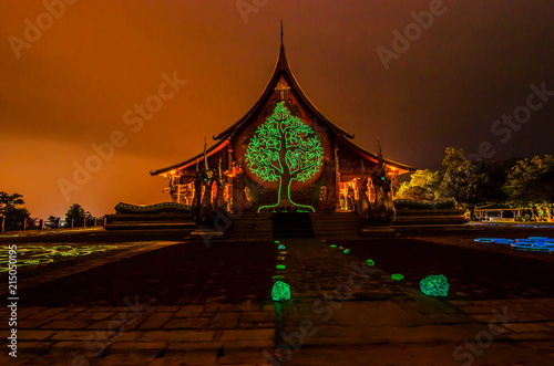 Amazing Temple Sirindhorn Wararam Phu proud in Ubon Ratchathani Province in Thailand and a wonderful light reflecting beautiful colors in the night for Long exposure photo taken.