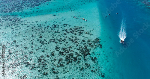 boat in a dream lagoon in French Polynesia, in an aerial view