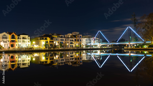 Night photo of apartments and a bridge