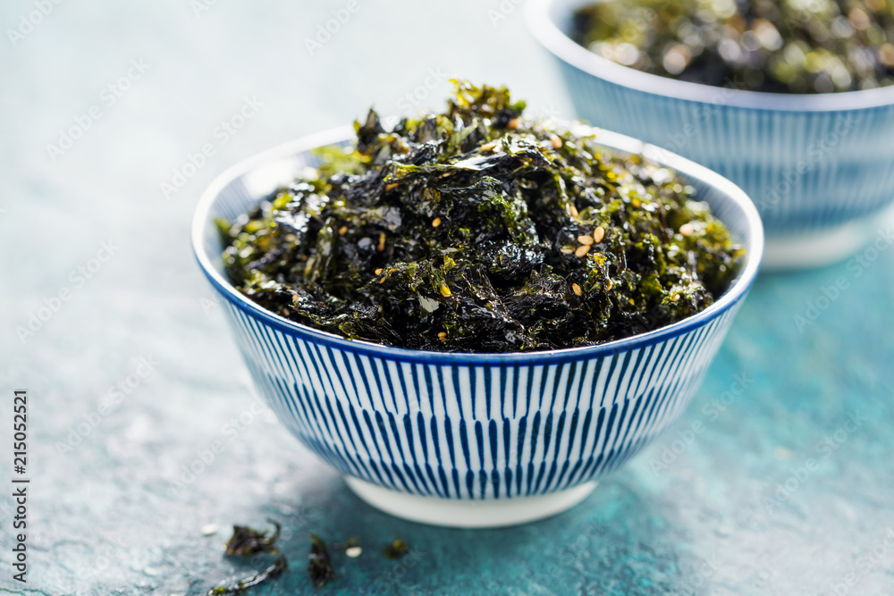 Crispy Nori Seaweed with sesame and sea salt. Selective focus. Crispy Nori Seaweed with sesame and sea salt. Selective focus.