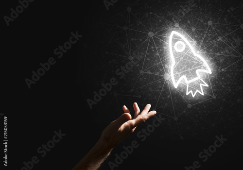 Man palm presenting Rocket web icon as technology concept