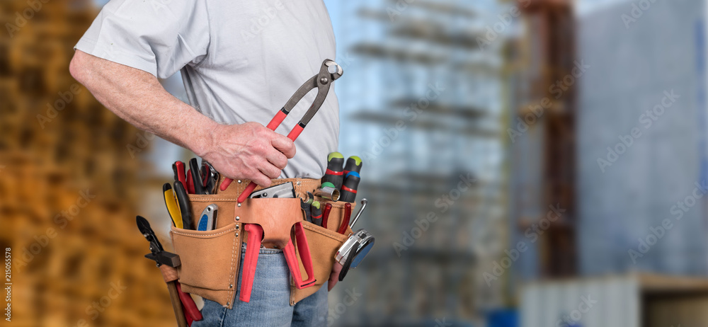 Building worker with tool belt Building worker with tool belt