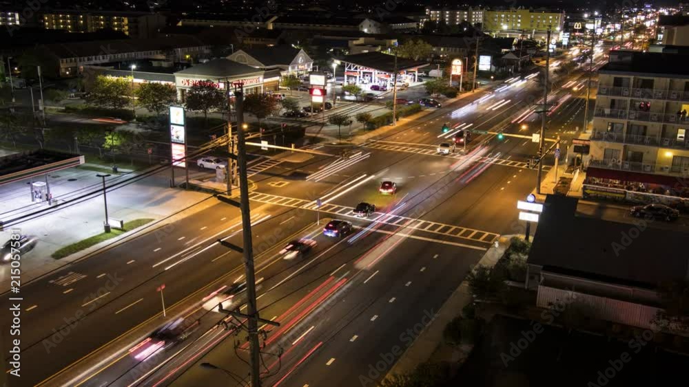 Time lapse of a busy intersection at night in Ocean City, Maryland; overhead shot Time lapse of a busy intersection at night in Ocean City, Maryland; overhead shot