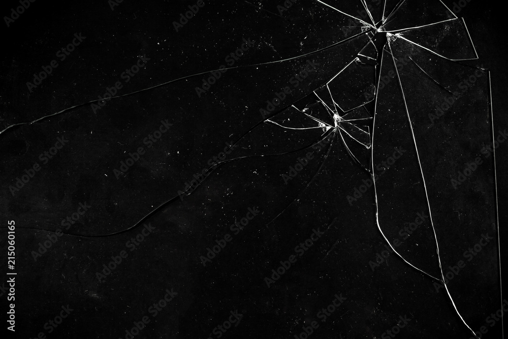 Foto de A broken glass on a dark surface, ripped in big and small