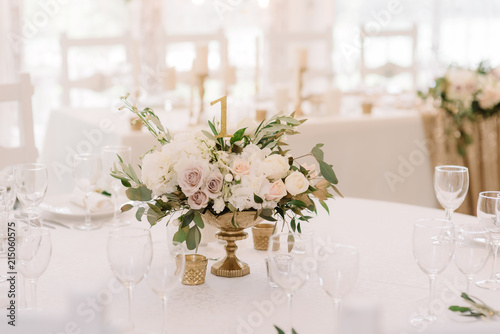 Table decor with a festive bouquet from fresh flowers.