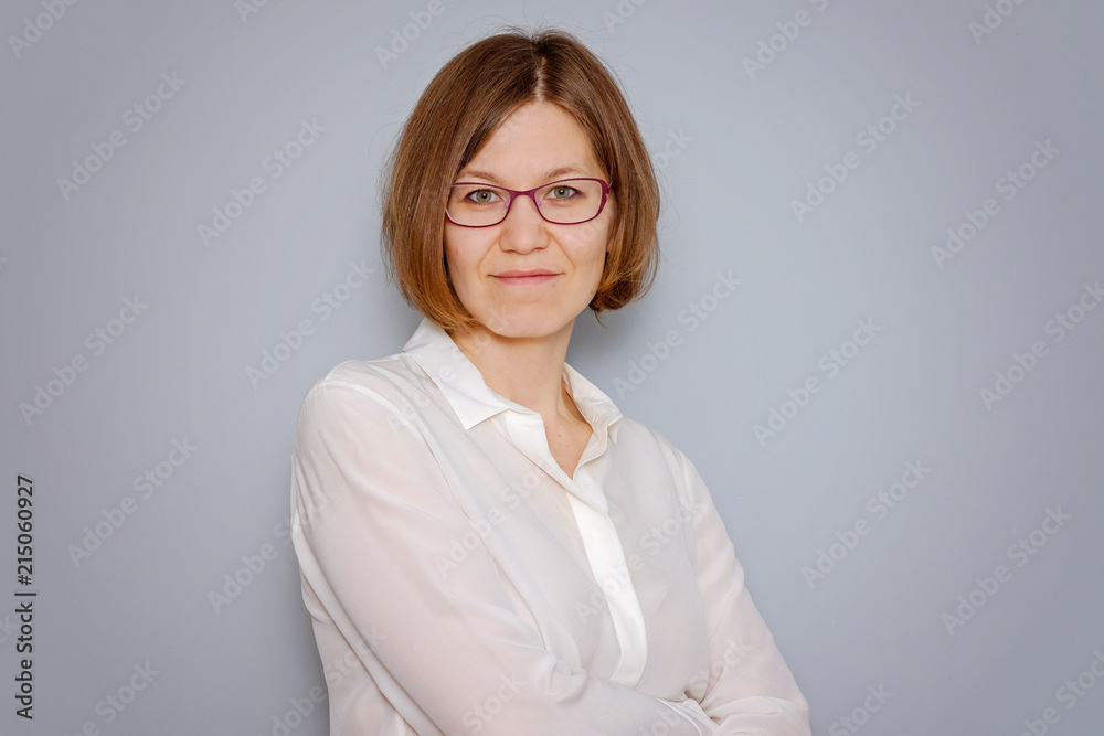 Portrait of a confindent business woman on grey background with copy space Portrait of a confindent business woman on grey background with copy space