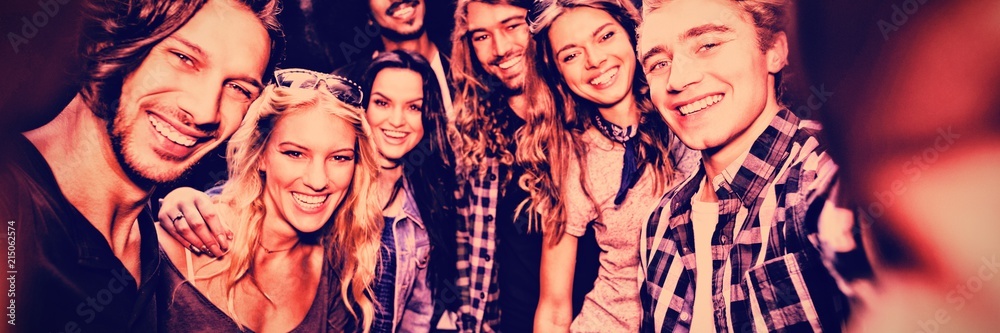 Fototapeta premium Portrait of cheerful young friends