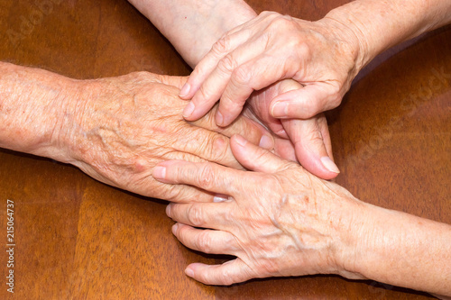 Old people holding hands. Closeup.