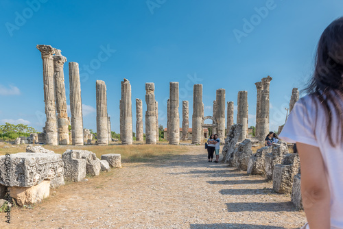 Unidentified tourists walking and exploring Zeus temple at Uzuncaburc Ancient city located in Uzuncaburc,Silifke,Mersin,Turkey.29 August 2017