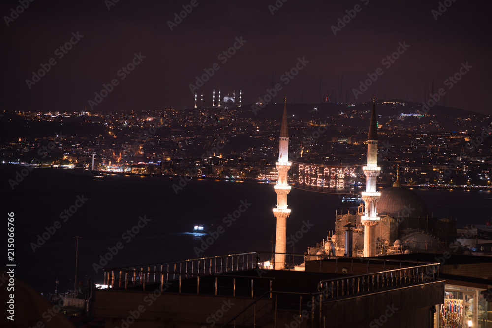 ISTANBUL, TURKEY - JUNE 4, 2017:Mahya of ”Muslims are brother” is written and hung between minarets of Suleymaniye Mosque. Mahya is to write with light especially during ramadan month for muslims