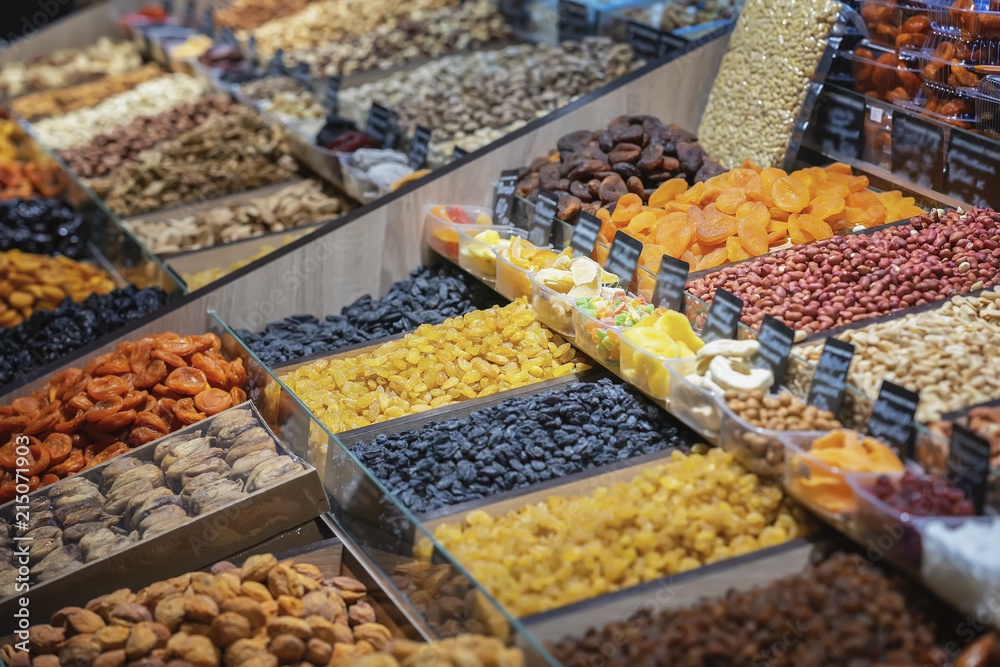 Assortment of organic dry, dried fruits, counter on the food market, organic healsy healthy snack, selective focus
