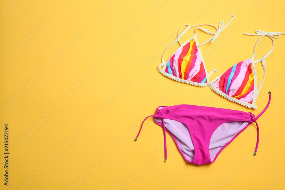 Obraz premium Stylish bikini on color background, top view