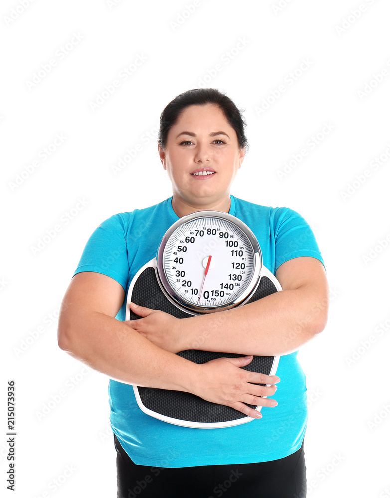 Overweight woman in sportswear with scales on white background Overweight woman in sportswear with scales on white background