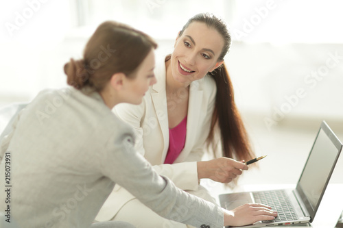 two women designers working on laptop © ASDF