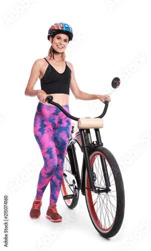 Portrait of sporty woman with bicycle on white background