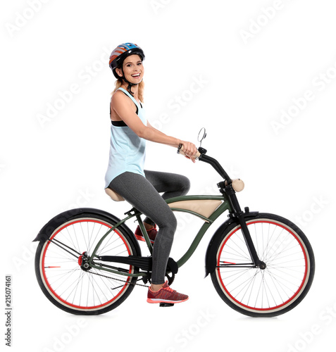 Portrait of sporty woman with bicycle on white background