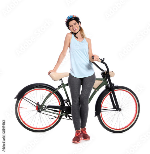 Portrait of sporty woman with bicycle on white background