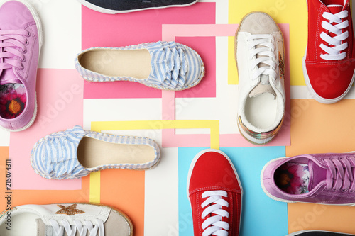 Flat lay composition with stylish new shoes on color background