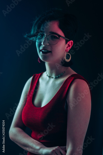 Fashion session in studio with elegant dress and earrings