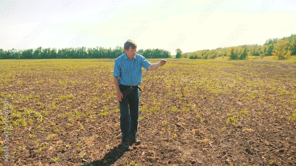 old man farmer working peasant hands holding fresh soil. slow motion video. old man ground dirt keeps the soil Symbol of spring and ecology concept. agriculture worker working in lifestyle the field