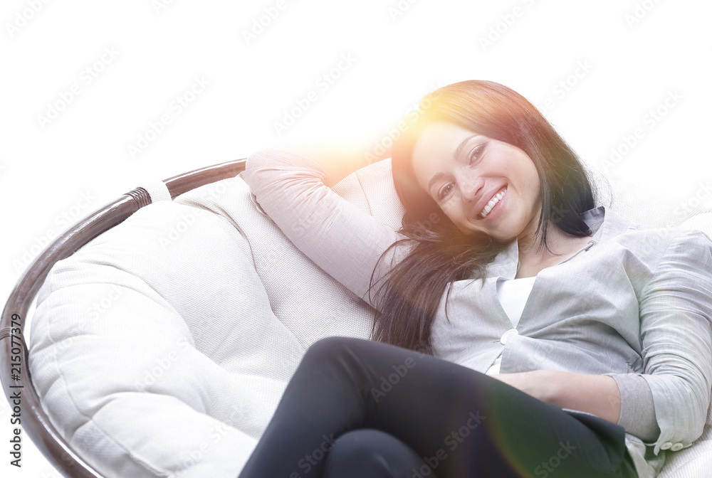 young woman sitting in a comfortable soft big armchair young woman sitting in a comfortable soft big armchair