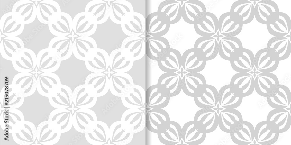 Light gray floral backgrounds. Set of seamless patterns Light gray floral backgrounds. Set of seamless patterns