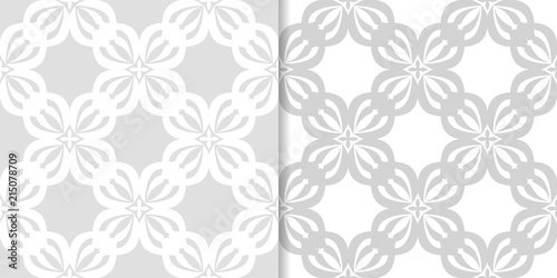 Light gray floral backgrounds. Set of seamless patterns