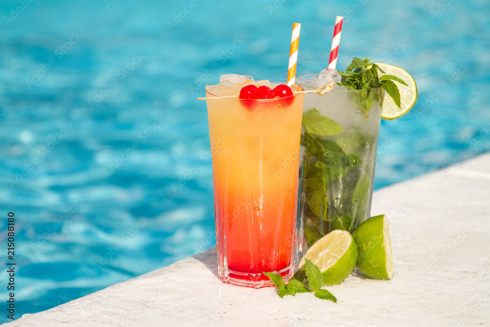 Tropical cocktail on a pool background