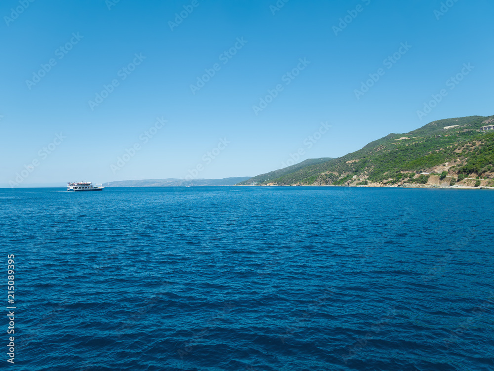 Ship sailing across the Aegean Sea. Athos, Greece