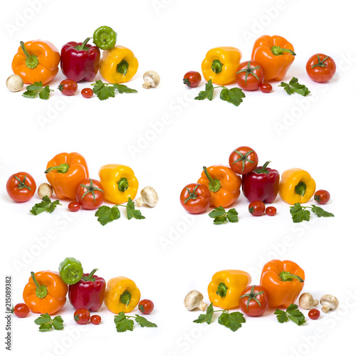 Red yellow and orange peppers with tomatoes on a white background..Multicolored vegetables in a composition on a white background..