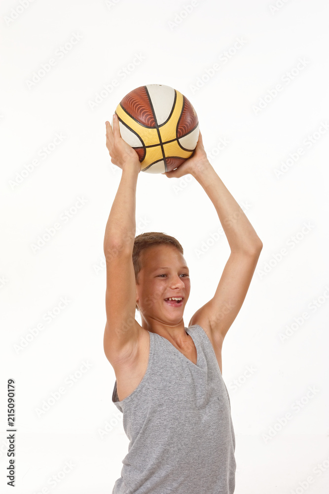 teenager with a basketball on a white background.