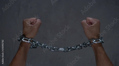 Freedom, concept of free man, broken chain in slow motion photo