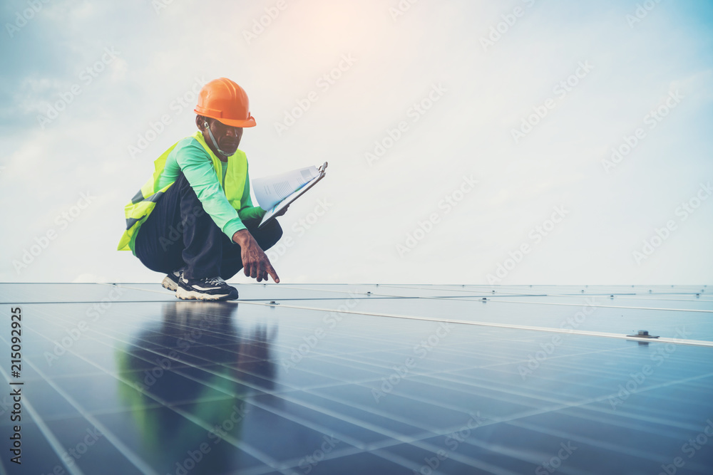 Obraz premium engineer working on maintenance panel in solar power plant