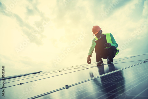 engineer working on maintenance panel in solar power plant