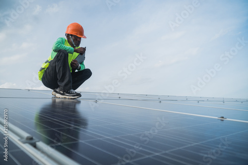 Wallpaper Mural engineer working on maintenance panel in solar power plant Torontodigital.ca