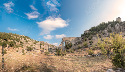 With blue sky,High resolution panoramic view of aqueducts or water bridges at Olba Ancient city located in Uzuncaburc,Silifke,Mersin,Turkey..