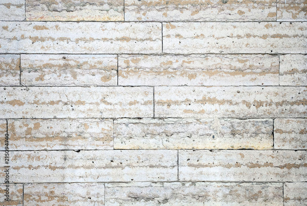 The structure of the wall of stone blocks under marble The structure of the wall of stone blocks under marble