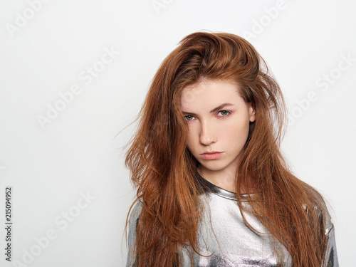 Young beautiful excited woman with gorgeous natural red hair green eyes  blank copy space on white background for advertisement or promotional text