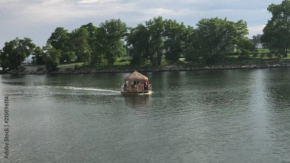 Tiki boat floating down a canal Tiki boat floating down a canal