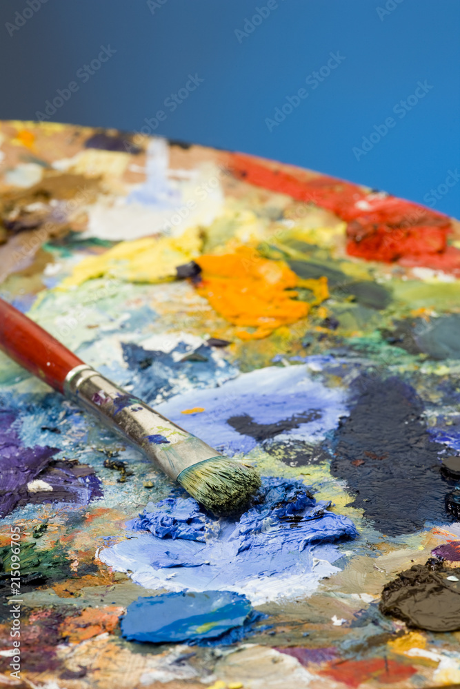 Fototapeta premium An artists paint palette and brush