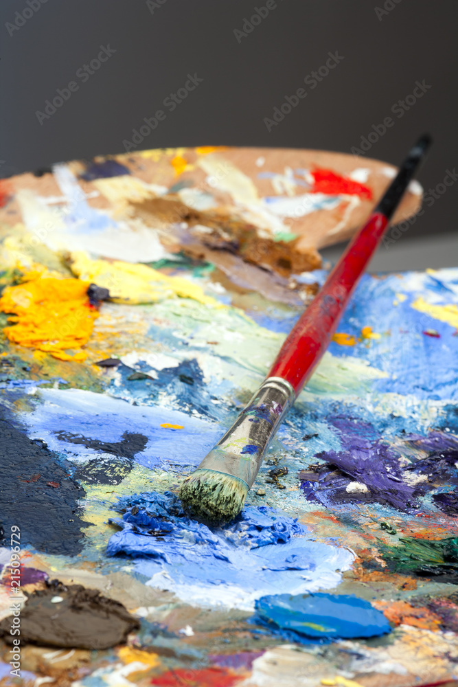 Fototapeta premium An artists paint palette and brush