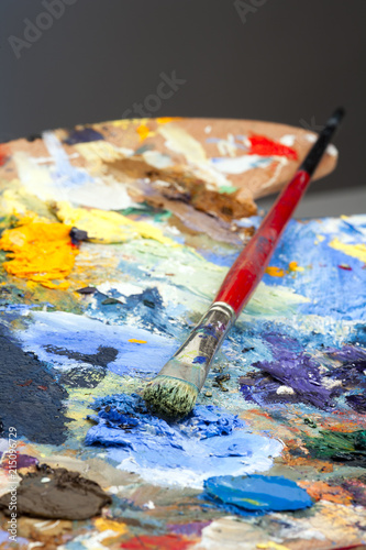 An artists paint palette and brush