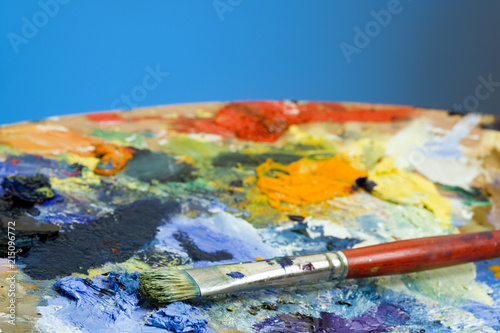 An artists paint palette and brush